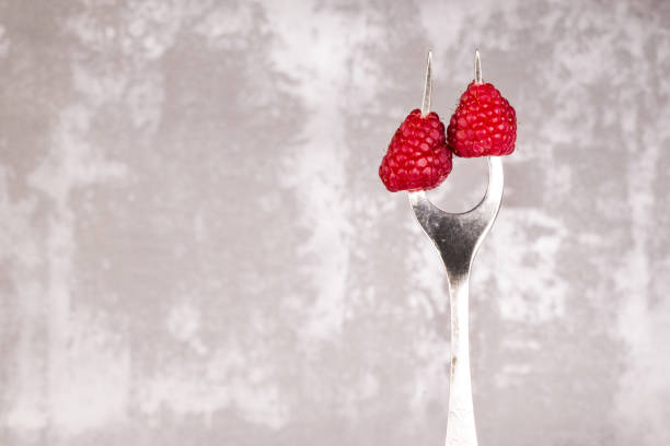 photo of Fresh blueberries and raspberries on background