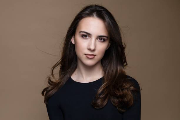 istock Young brunette girl in black and white combination studio portrait 2089602267