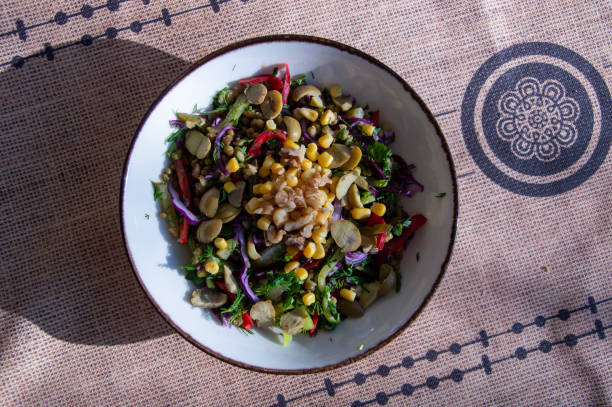 Organic Vegan Quinoa with vegetables like corn, olives, red peppers and purple cabbage