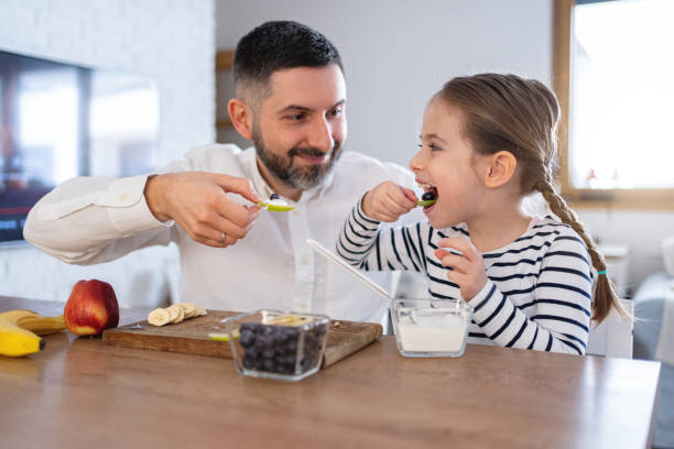 istock Daughter and father sharing an healthy breakfast 2089626788