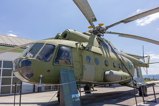 Pivka, Slovenia - June 25, 2023: Assault and transport historic military helicopter Mil Mi-8 on display at the Pivka Park of Military History