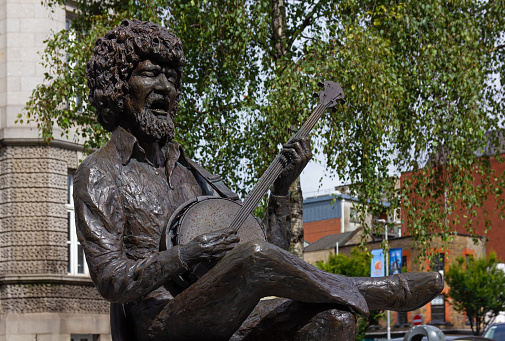 Dublin, Ireland - August 5 2023: Close-up of the bronze statue of Luke Kelly Dublin born singer, folk musician, actor and founding member of the well known band The Dubliners.