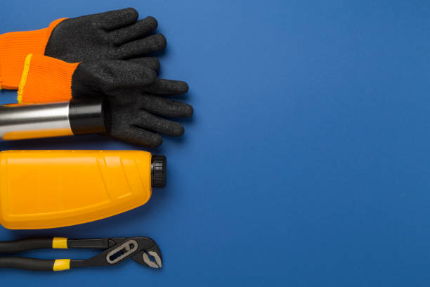 Car tools and accessories on color background, top view