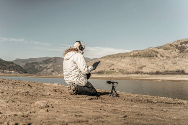 ai & soundscape ecology. field biologist does bioacoustics monitoring. - soundscape ストックフォトと画像