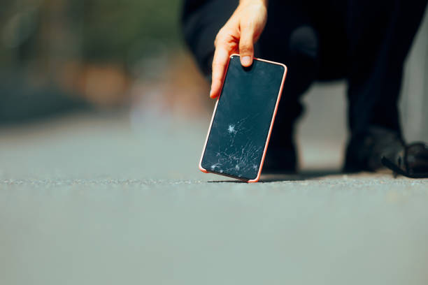 istock Woman Dropping her Smartphone on the Pavement Breaking it 2089970164