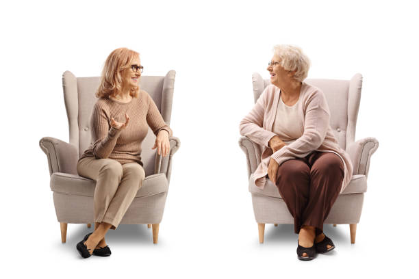 istock Elderly mother and daughter sitting armchairs and talking 2090010090