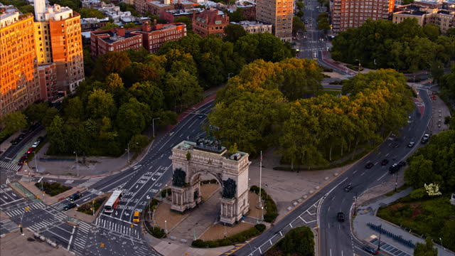 Prospect Park Plaza, known as Grand Army Plaza, with the main entrance of Prospect Park at sunrise. Aerial video with the panning-orbiting camera motion.