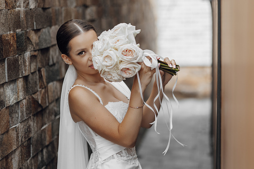 Wedding concept, modern European bride. Ideas for a minimalist wedding in nature. Beautiful bride