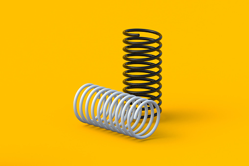 Two metal springs on prange background. Flexibility wire. Twisted steel coils. Auto parts. Accessories for automotive maintenance. 3d render