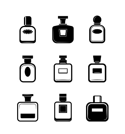 Collection of black and white perfume bottles.