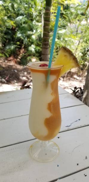 istock Tropical frozen alcoholic drink with pineapple slice and drinking straw 2090062093