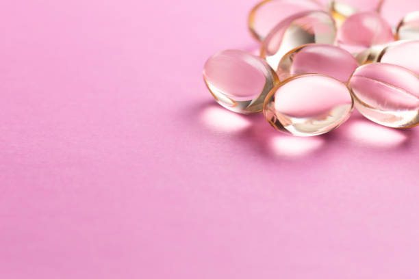 istock Supplements and medicine tablets on a pink background. 2090107372