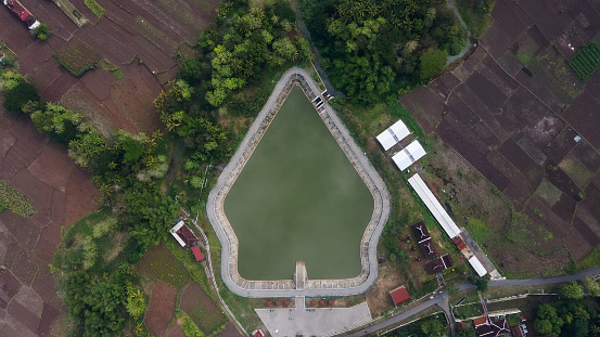 Aerial view of Imogiri 2 embung which has a shape like a Wayang mountain / kayonan, located in Bantul, Indonesia.