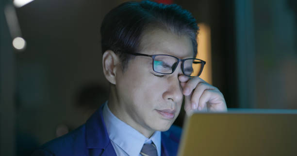 senior businessman has tired eye