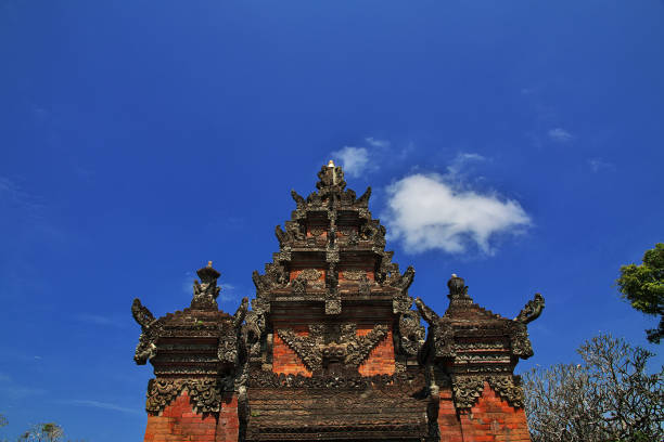 Closeup of an intricate door fully carved around Tanah Lot Temple in Bali. Taken January 2022.