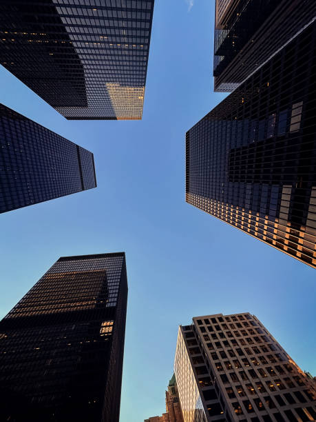 istock Low-angle view of modern skyscrapers in city. 2090343315