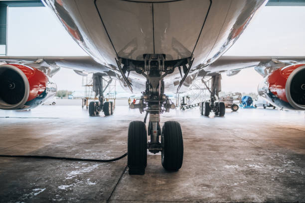 istock Airplane in hangar and landing gear 2090364322