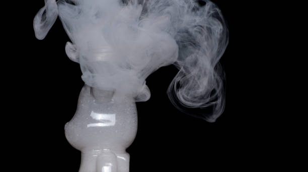 White smoke is coming out of a metal container containing liquid nitrogen
