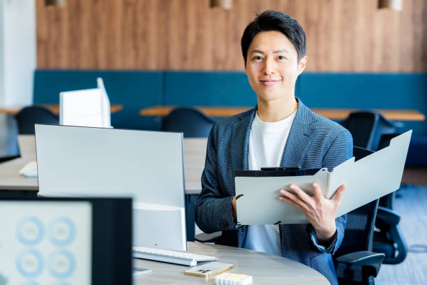 istock business person working in office 2090413454