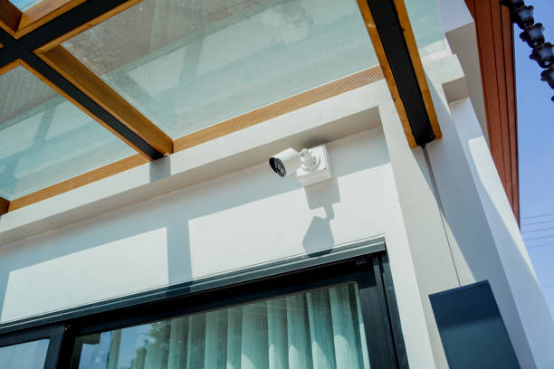 Modern CCTV camera on a wall of a residential building