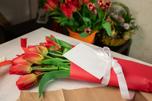 Tulip bouquet and card, wedding present, congratulations message, floral arrangement.