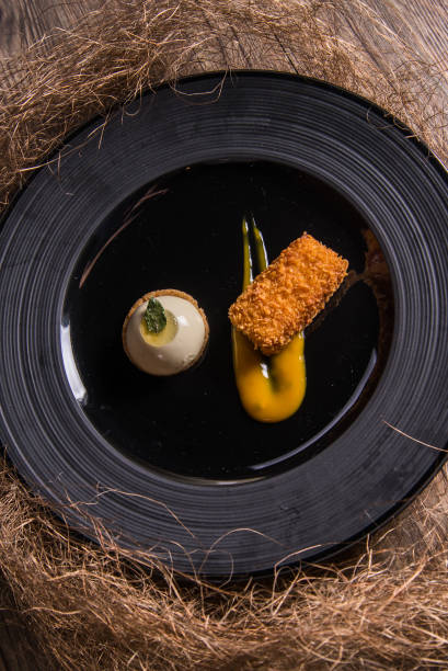 istock deep fried crispy banana fruit red bean cake mochi with vanilla ice cream and mango jam sauce in black plate on bamboo wood table asian cafe cuisine Chinese restaurant banquet halal food menu 2090513751