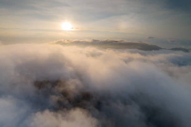 istock The sun rises over a sea of mist. 2090542218