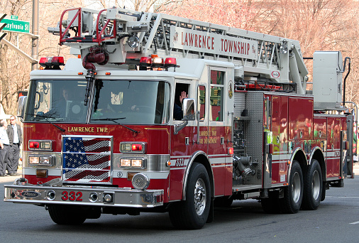Indianapolis, IN, USA-March 17,2009:Fire Fighters of Lawrence Twp. Fire Department with Fire Truck greets people at St Patrick Day Parade