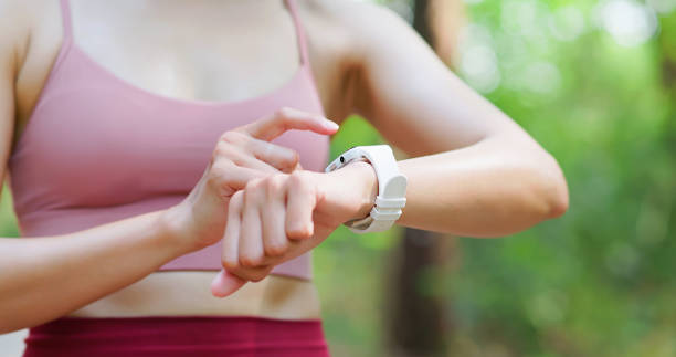 istock asian woman set up smartwatch 2090612805