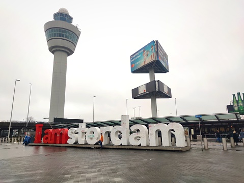 Schiphol, Netherlands - February 2024: Tourist attraction with white and red colored three-dimensional letters \