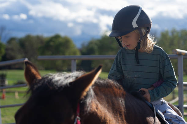 istock Children learning to ride horses 2090624909