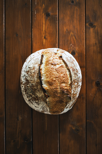 Freshly baked Homemade Artisan Sourdough Bread on the wooden background