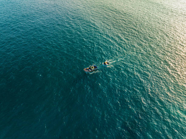 istock Fishing boat dragging a basket boat 2090656318