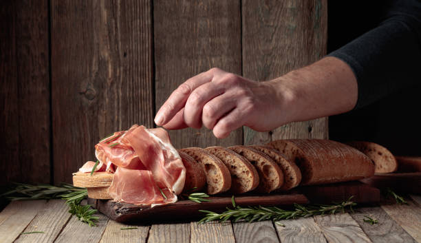 istock The hand of a prosciutto thief. 2090672351