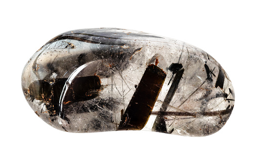 polished quartz gem stone with black tourmaline crystals cutout on white background