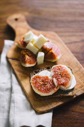 Healthy fig bruschetta with sourdough rye bread and cheese