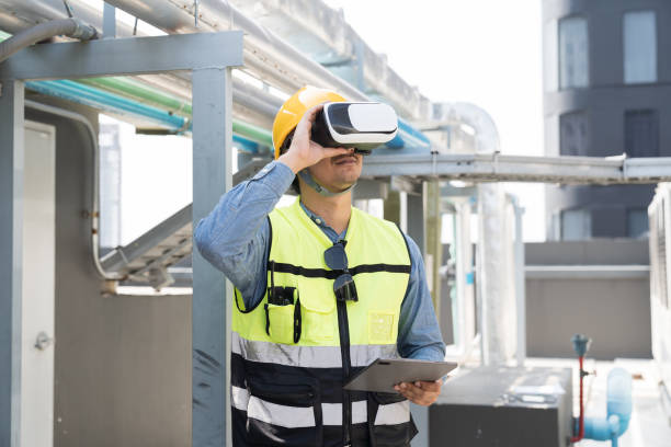 istock Male engineer using virtual reality headset inspecting quality of water pipes system at rooftop of building. Male plumber wearing virtual reality headset for inspecting water pipes network system 2090711768