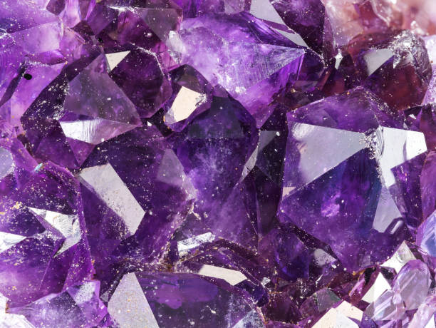 istock raw amethyst crystals in natural geode closeup 2090716528