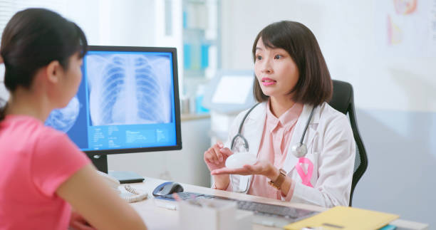 istock Asian doctor explain breast implant 2090739604