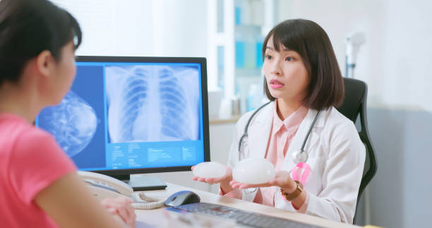 istock Asian doctor explain breast implant 2090739644