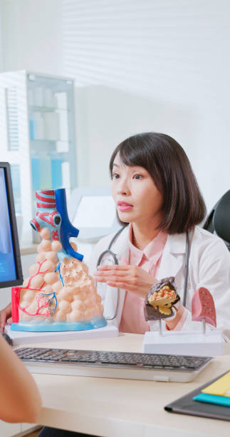 istock asian doctor explain lung alveoli 2090742739