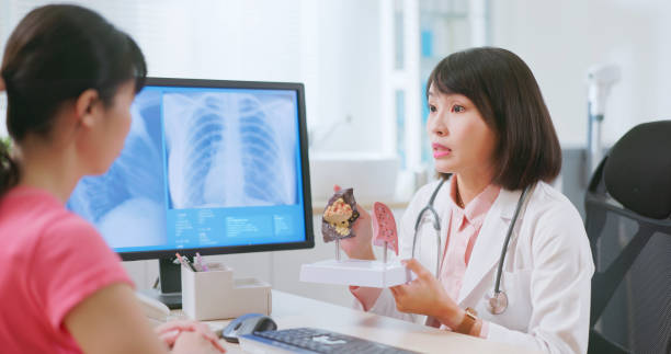 istock asian doctor explain lung illness 2090744044