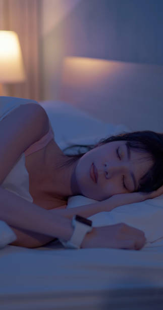istock asian woman sleep with smartwatch 2090756924