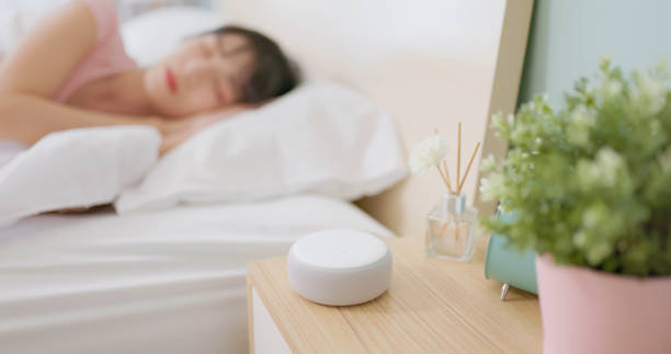 asian woman use smartphone alarm