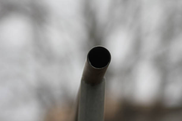 A close up of a metallic pipe