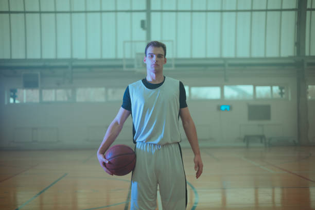 istock Professional basketball player training in an empty basketball stadium. 2090782095