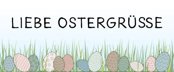 Vector illustration of Liebe Ostergrüße - text in German language - Easter greetings. Greeting card with pastel-colored Easter eggs in the grass.