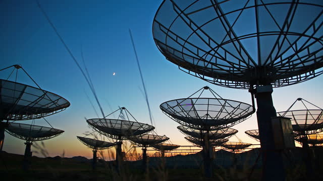 Satellite array under sunset