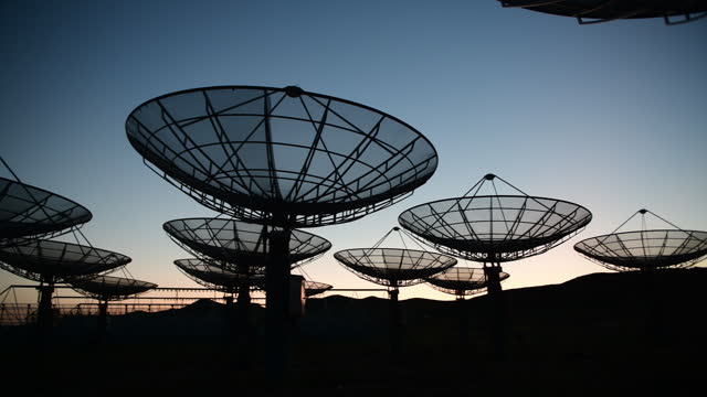 Satellite array under sunset
