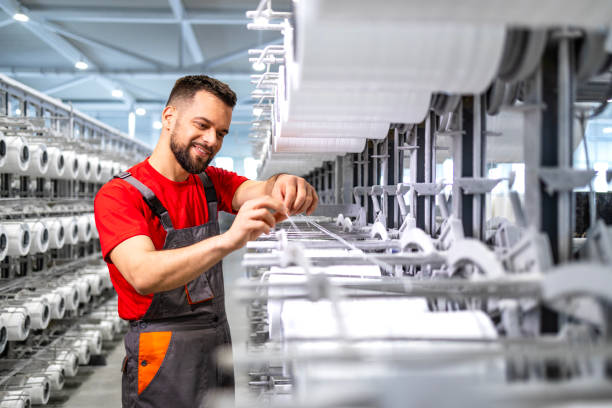 istock Working in textile manufacturing plant. 2090879418